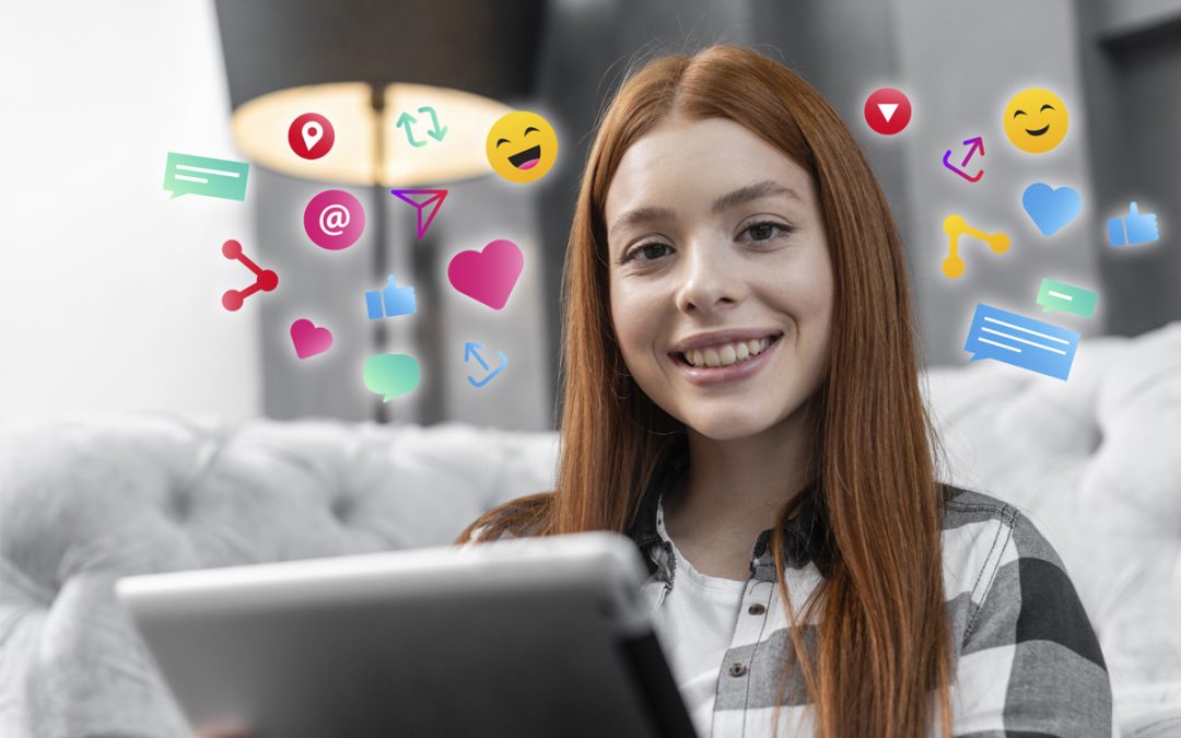 Happy small business owner and freelancer using laptop to manage social media efficiently with tools like SocialBee